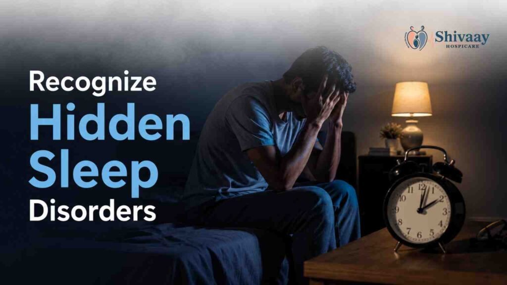 Man sitting awake at night with insomnia, highlighting symptoms of hidden sleep disorders.
