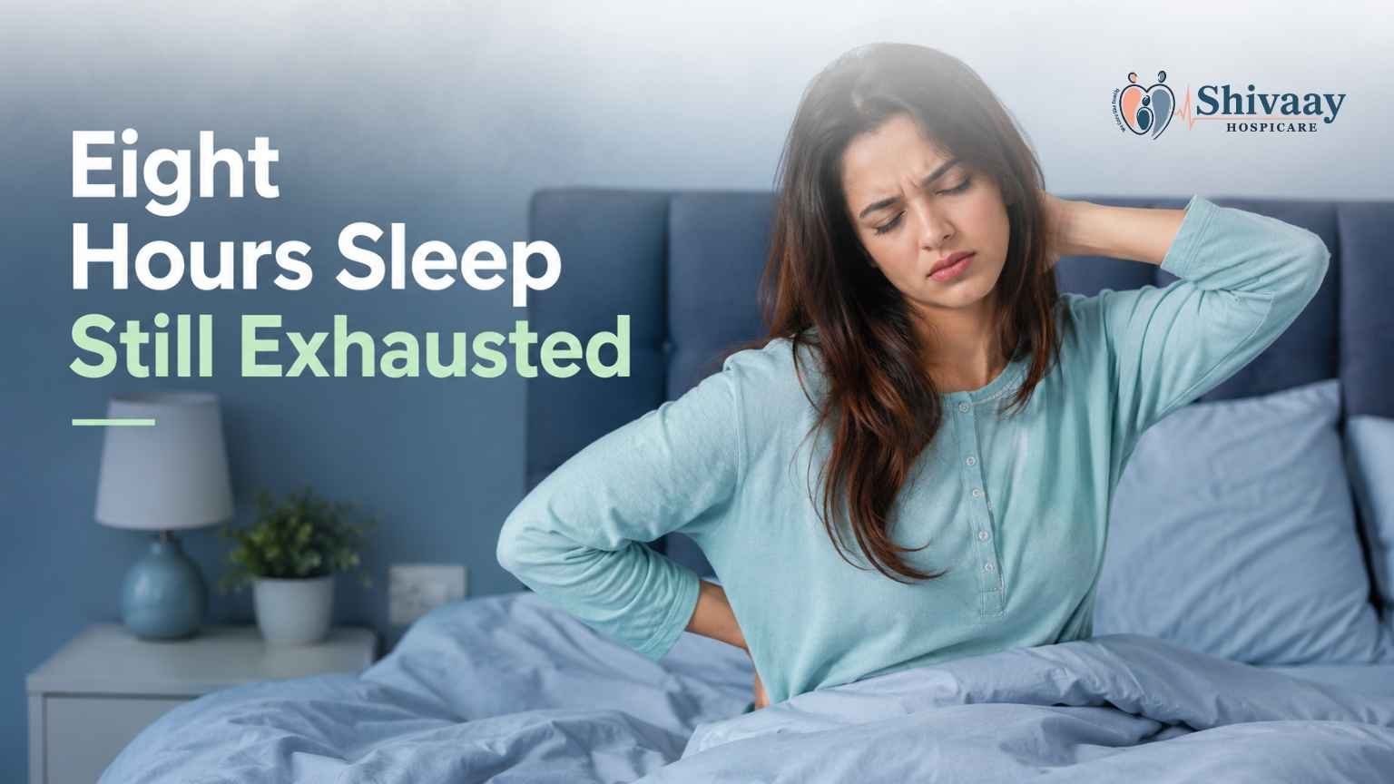 Woman sitting on a bed looking tired and experiencing fatigue despite getting eight hours of sleep.